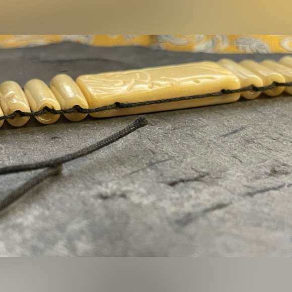 Beautiful simulated bone choker necklace with elephant engraved ties at back - Picture 2 of 8